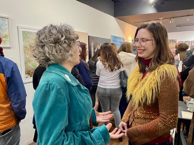 CamCreatives members in conversation at the Art Show 2026 launch party.